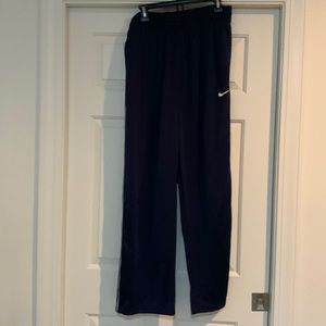 Nike navy pants with white stripes down the sides